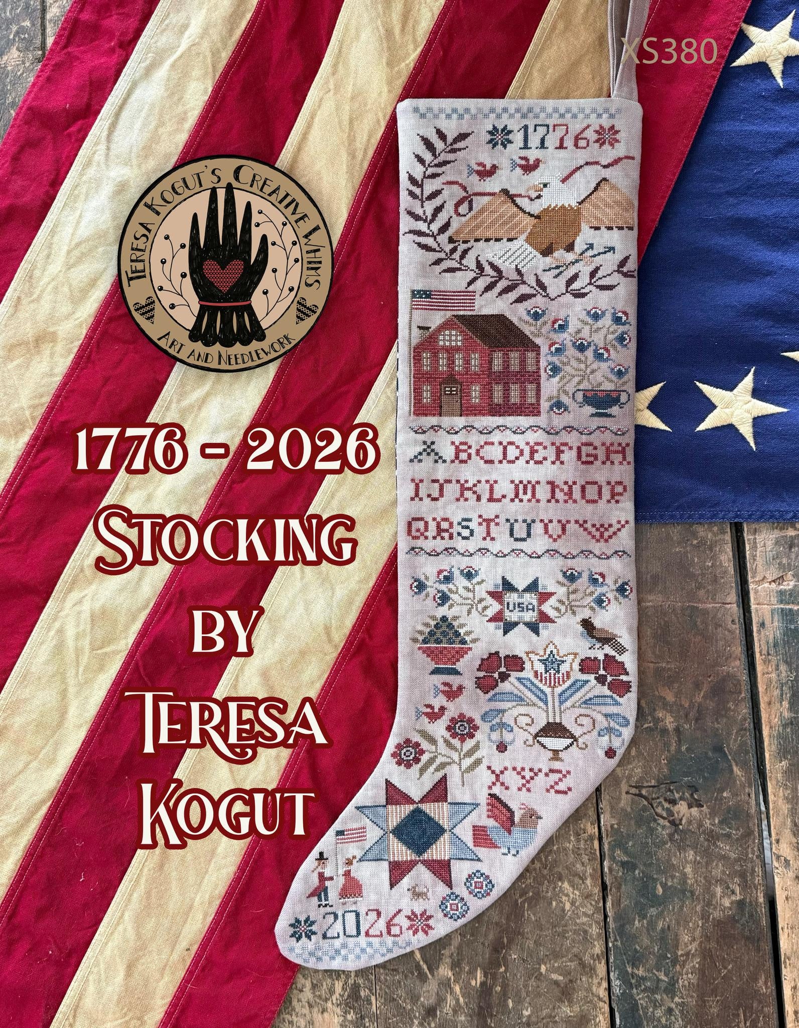 Decorative stocking with intricate patterns on a wooden surface with an American flag in the background.