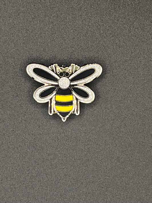 Bee-shaped needle minder on a gray background