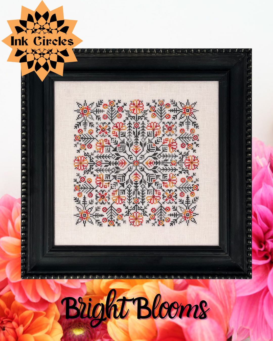 Framed cross-stitch pattern with floral design on a white background, surrounded by flowers.