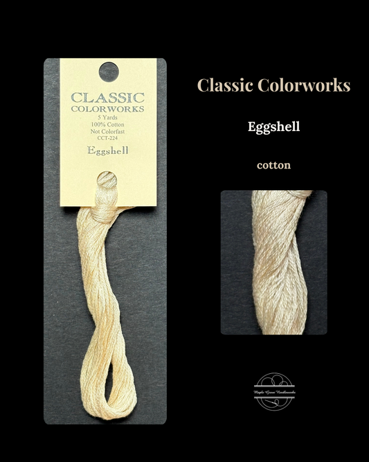 Eggshell cotton thread on a Classic Colorworks card with close-up on a black background