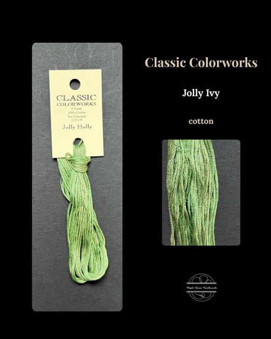 Green embroidery floss on a Classic Colorworks Jolly Ivy card against a black background