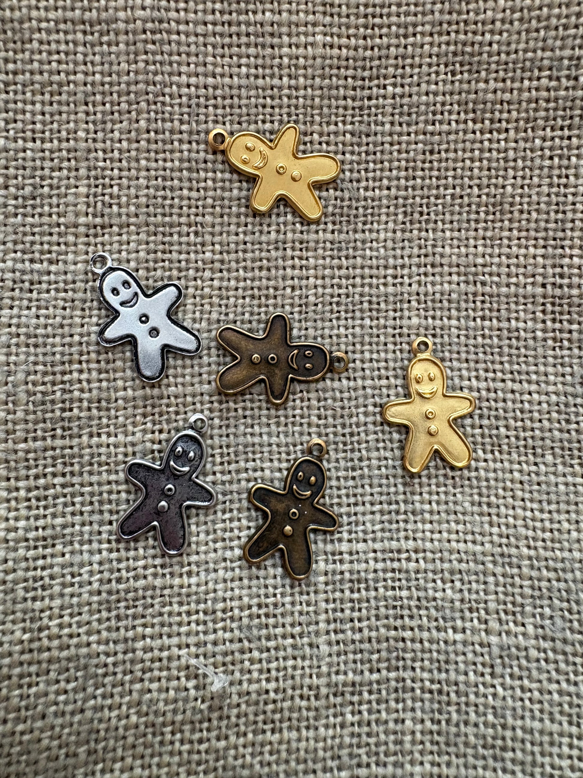 Gingerbread man in silver, antique gold, and gold