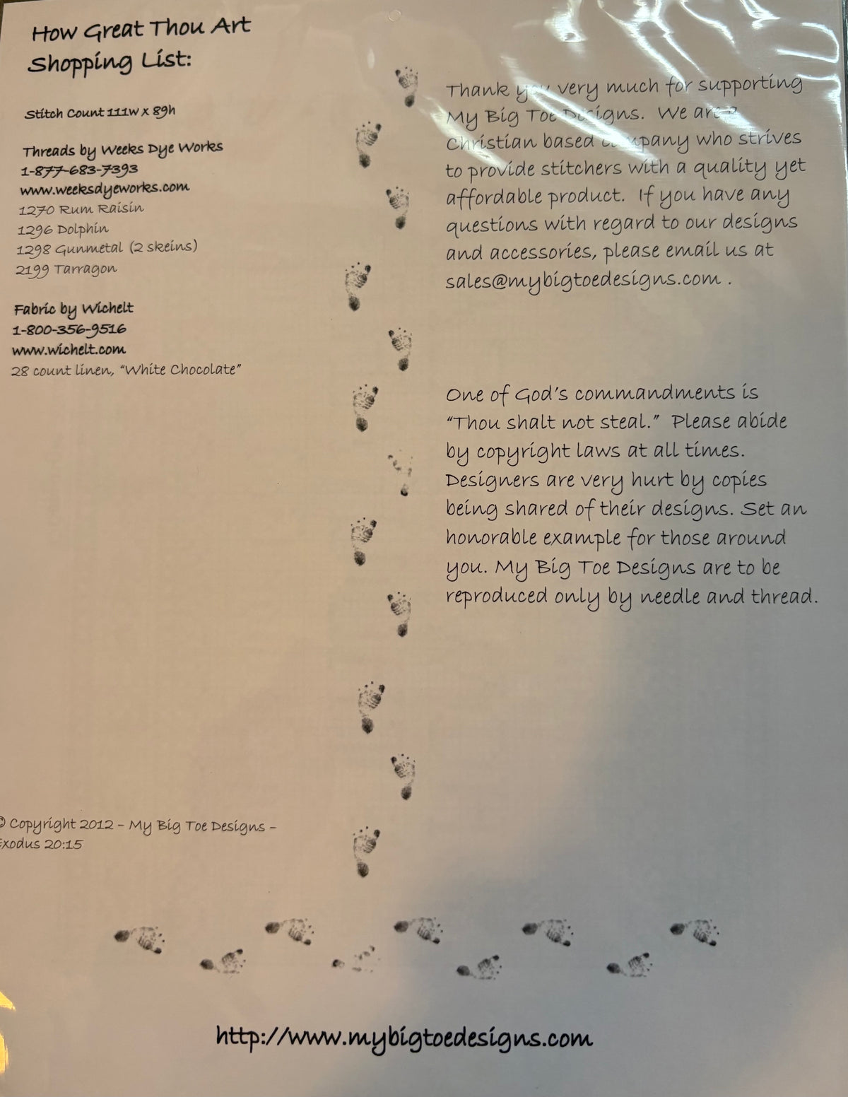 A beige sheet with handwritten text, footprints, and a copyright notice for My Big Toe Designs, photographed flat against a white background.