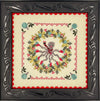Decorative cross-stitched design with a skull and floral wreath in a decorative frame.