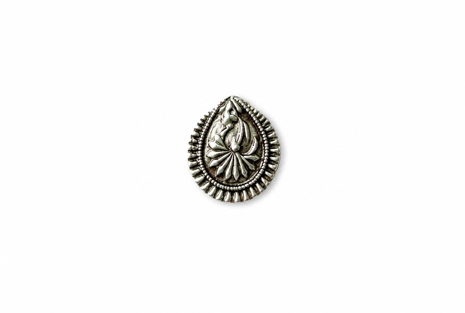 Silver teardrop-shaped decorative element on a white background