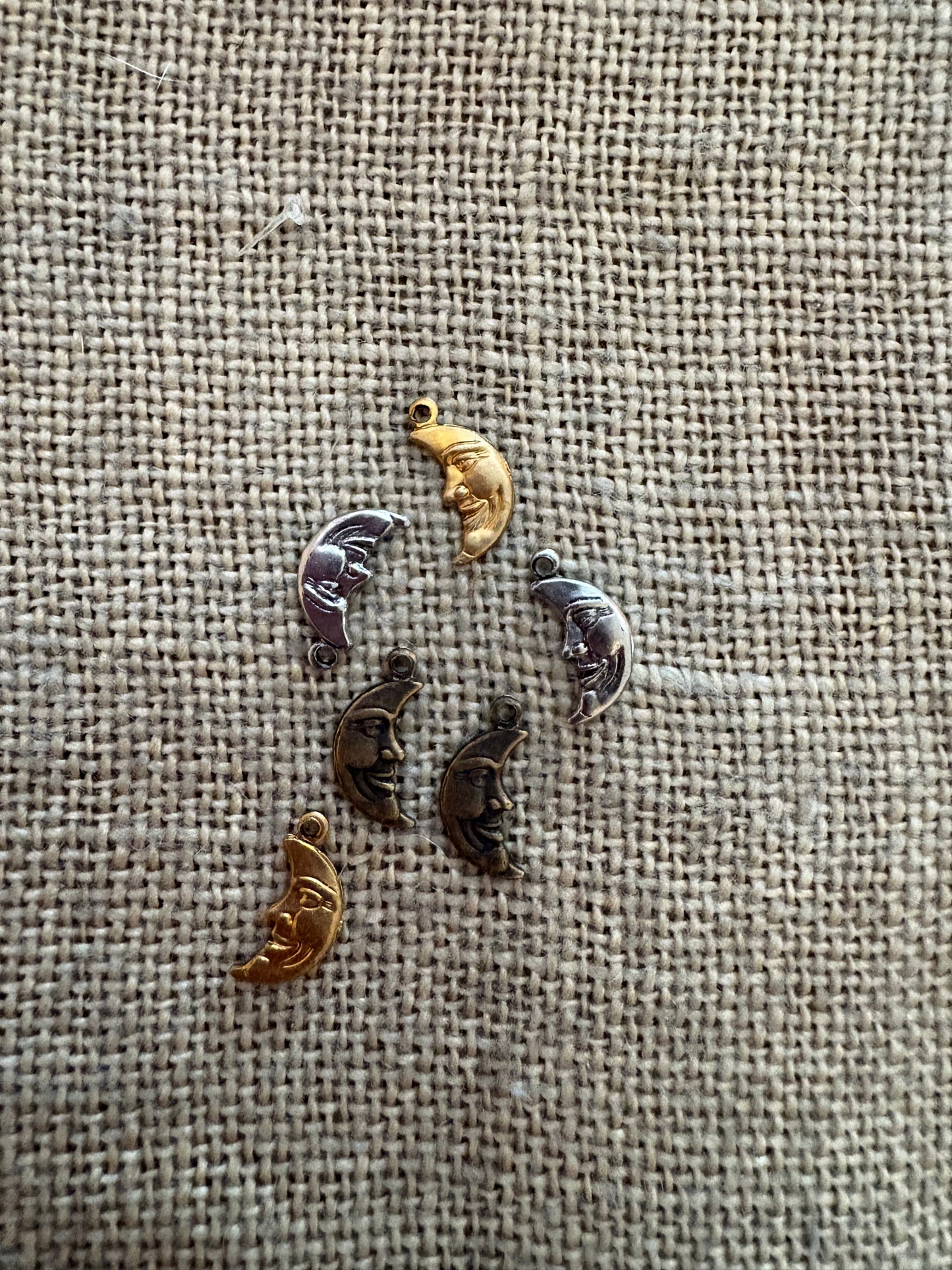 Small smiling half moon resembling a textured fabric background