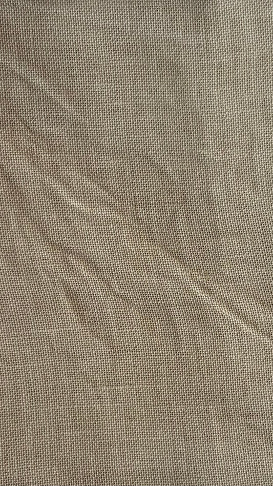 Close-up of textured brown fabric known as R&R Creme Brulee 32ct Linen