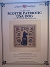 Front cover of a counted cross stitch pattern booklet titled 'The Dog Days: Scottie Patriotic USA Dog' by Happiness in a Frank Mead, showing a central stitched dog design on a cream background.
