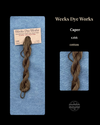 Brown yarn skein on Weeks Dye Works packaging with product name and color number.