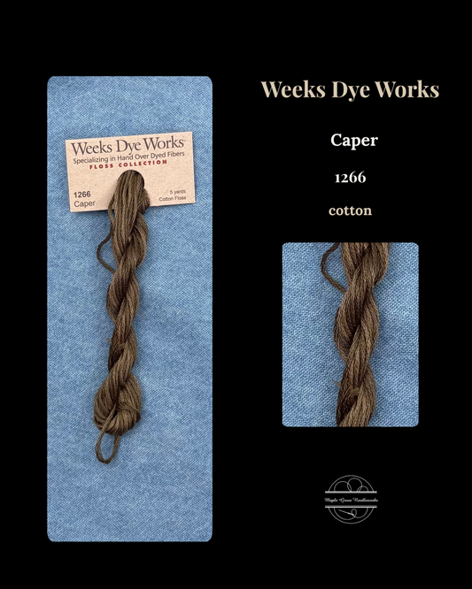 Brown yarn skein on Weeks Dye Works packaging with product name and color number.