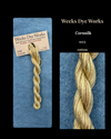 Weeks Dye Works cornsilk yarn with packaging and label on a blue background