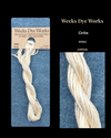 Weeks Dye Works cotton floss package with a sample on a blue background