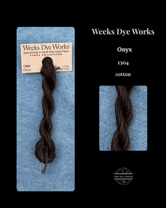 Weeks Dye Works Onyx cotton floss on a blue card with brand name.