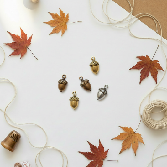 Acorn charms on autumn background