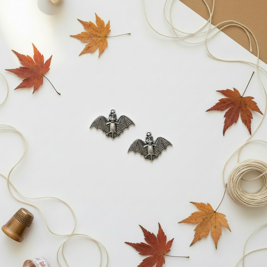 Bat charms on autumn background