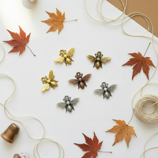 Bee charms on autumn background