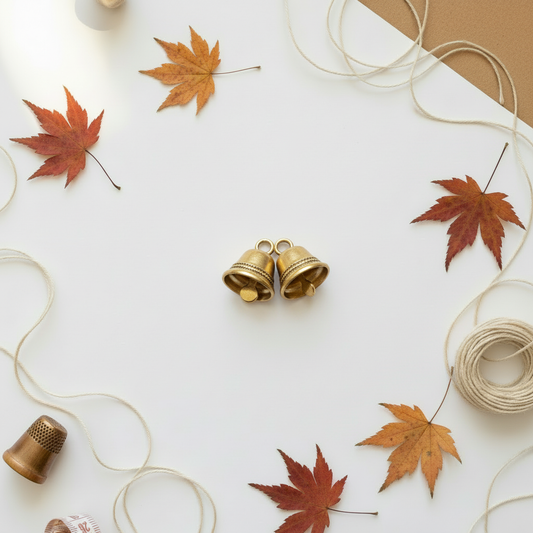 Bell charms on autumn background
