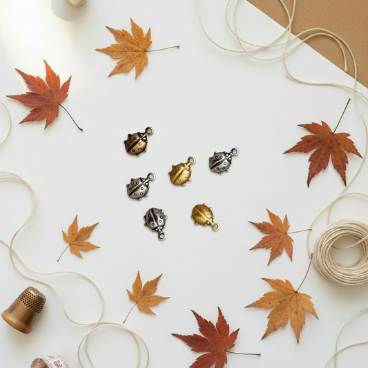 Ladybug charms on autumn background