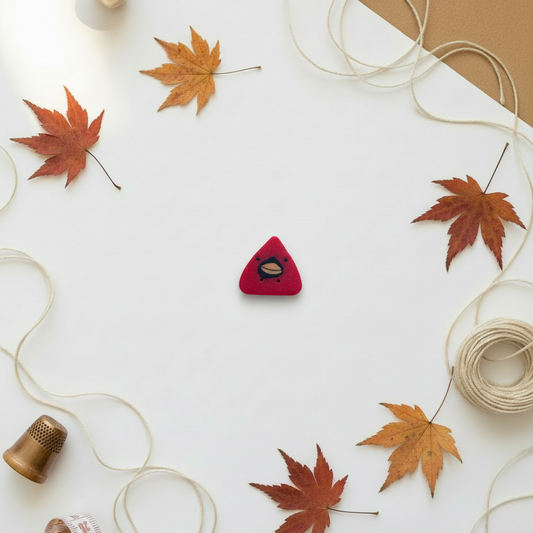 Large cardinal button on autumn background