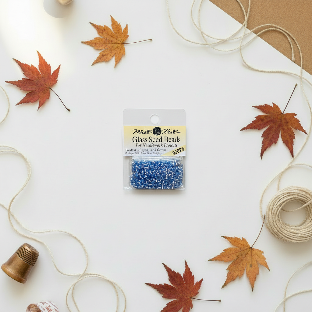 Mill Hill Crystal Blue Seed Beads on autumn background