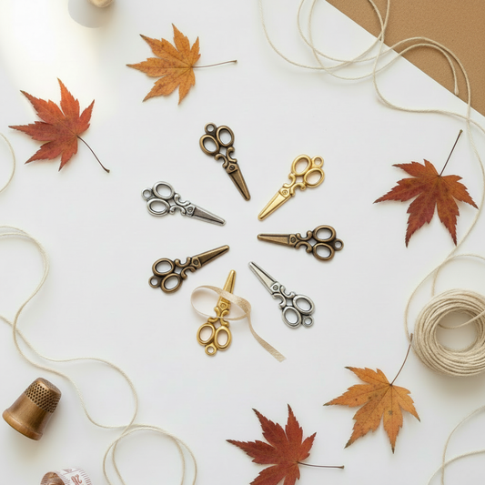 Scissors charms on autumn background