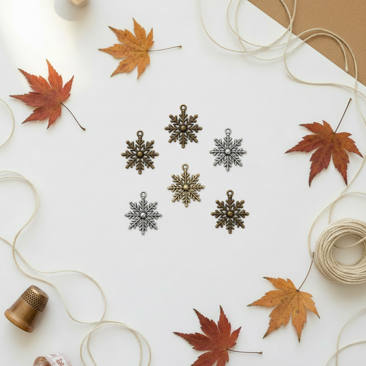 Snowflake charms on autumn background