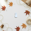 Snowman button on autumn background