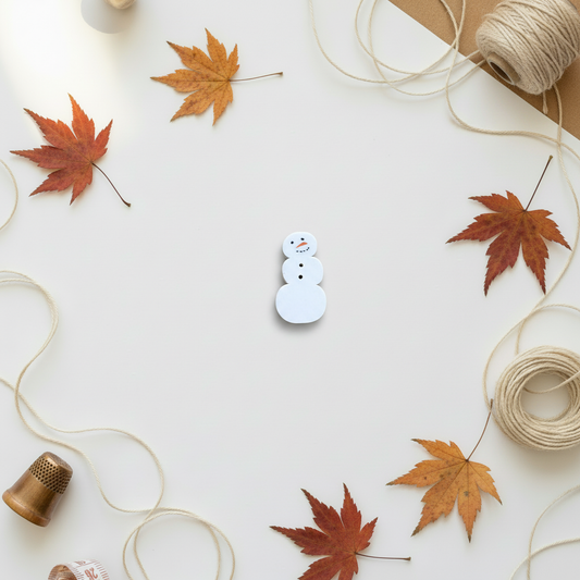 Snowman button on autumn background