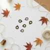 Wreath charms on autumn background